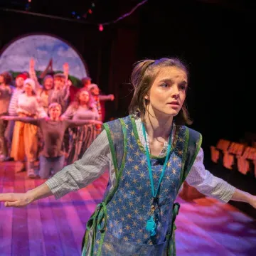 students on stage in Starcatcher performance 